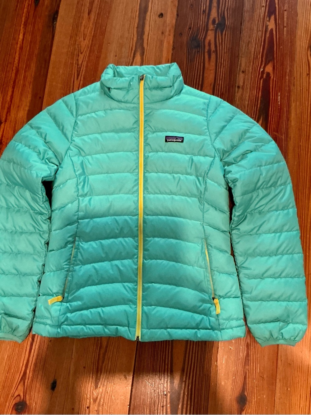 Patagonia Women's Teal Puffer Jacket with Yellow Zippers